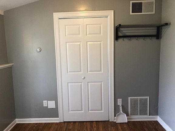 Room off den which holds washer and dryer