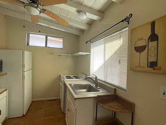 kitchen, Ref, stove, microwave table, and shelves