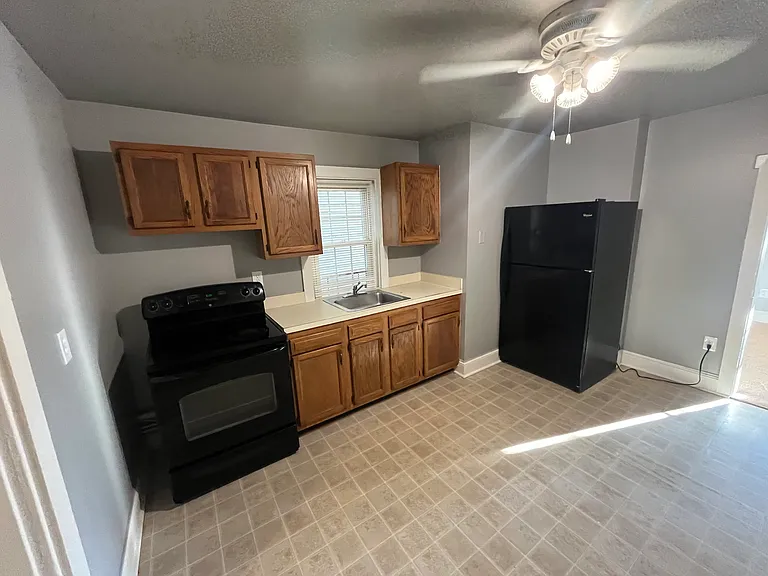 Kitchen (laundry/storage room to the left, living room to the right).