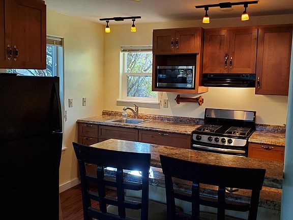 Full kitchen with a natural gas range