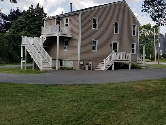Your own private back deck, over looking private back yard with stone wall.