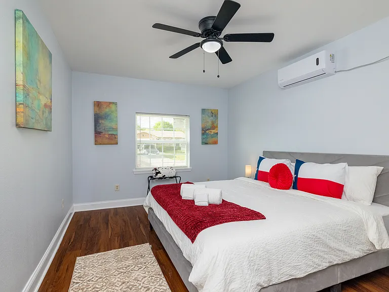 This bright primary bedroom offers a king bed and cozy Texas-themed decor.
