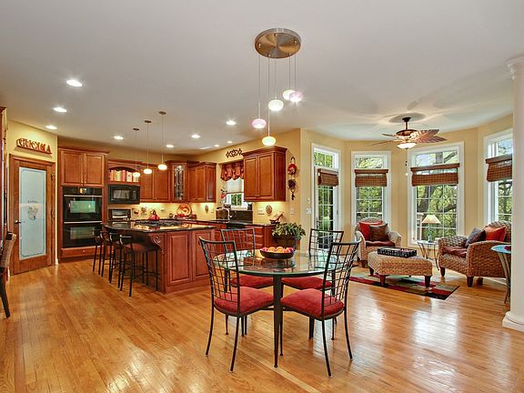CHEF'S KITCHEN WITH WALK-IN PANTRY, PLANNING DESK, HUGE ISLAND WITH SEATING AND ACCESS OUT TO YOUR PRIVATE DECK