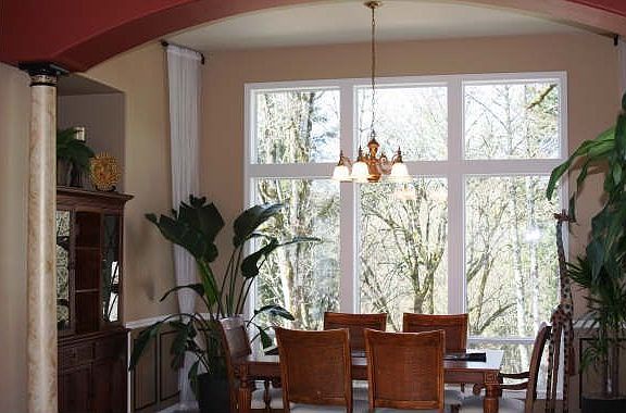 Formal Dining Room w/Picture Windows to Greenspace