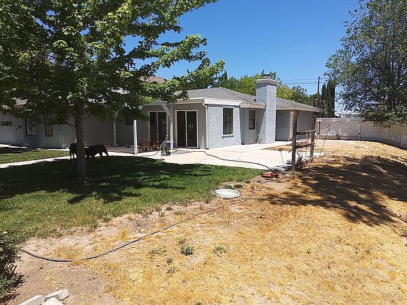Backyard facing house. 