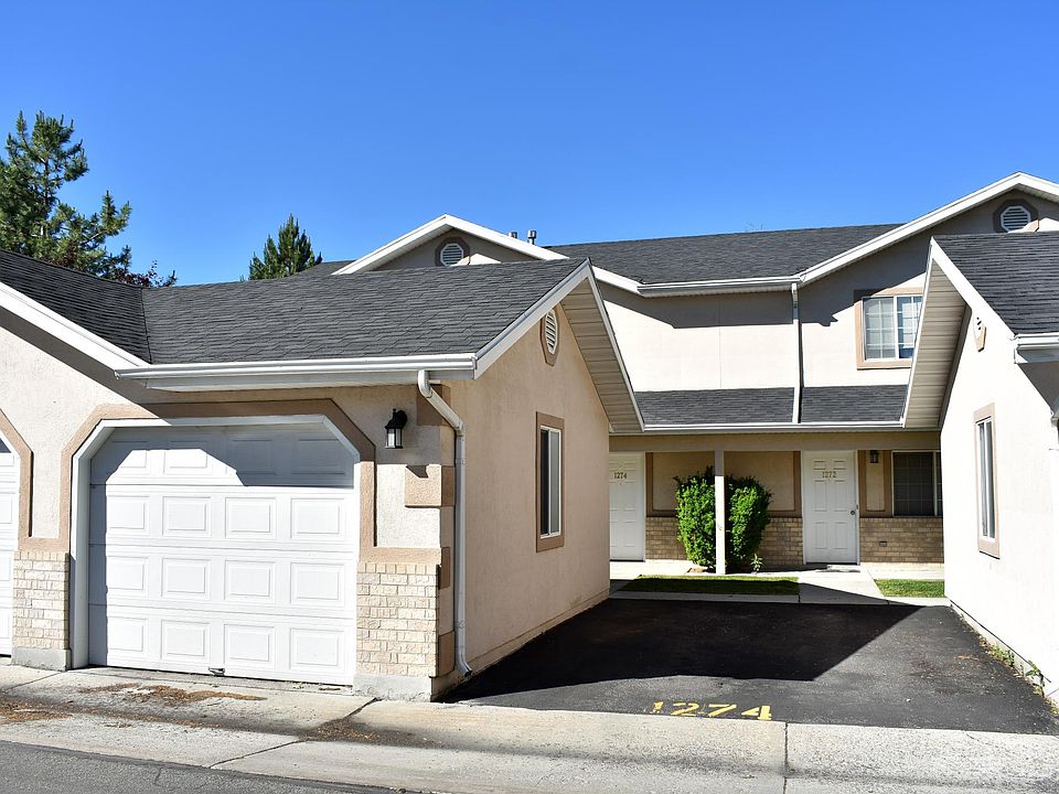 Front entry, garage and parking space