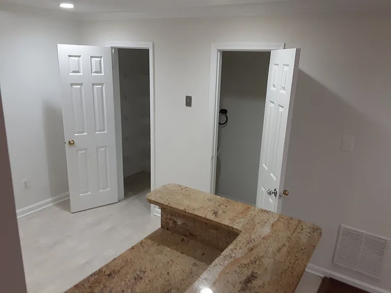 Pantry Entrance to Left and Half-Bath to Right