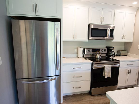 kitchen with stainless steel appliances and modern cabinets
