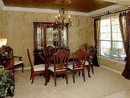 Professionally painted dining room is absolutely outstanding and makes such a statement in this home