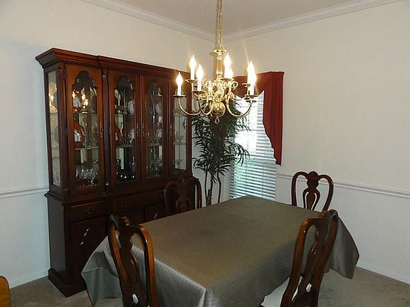 A large window lets in the light to the formal dining room.