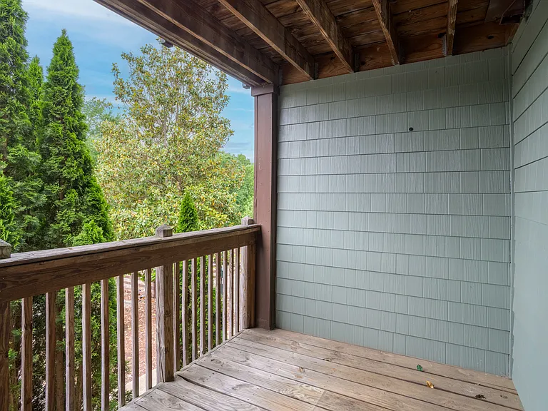 Step outside to your private balconyan intimate outdoor retreat nestled under mature trees, perfect for morning coffee or evening chill.