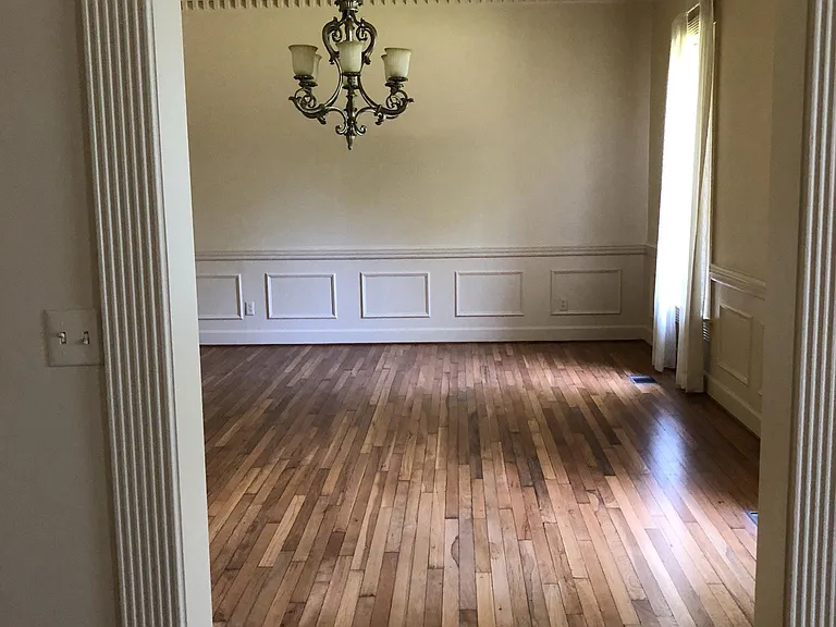 Huge Dining room with chair rail and handcrafted moulding