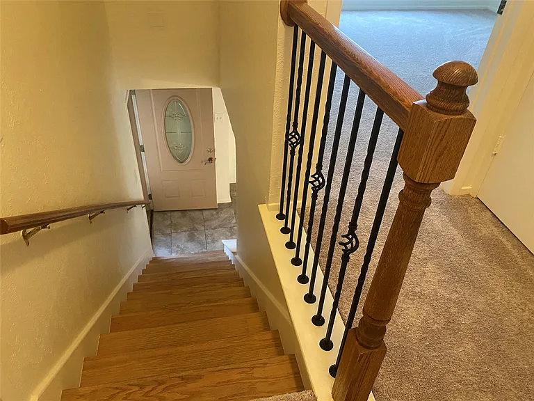 Iron spindles on stair case.