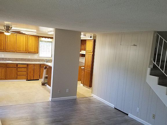 Open living area kitchen has NEW GRANITE