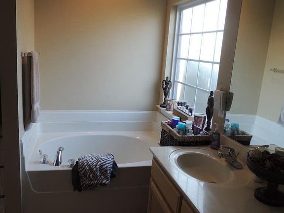 master bath with huge walk in closet