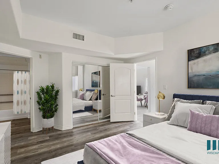 Bedroom with Mirrored Closet, Vinyl Flooring, and Bathroom