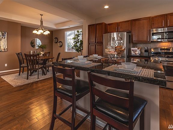 This house was made for entertaining!  Check out this gourmet kitchen and large dining room with tray ceilings.