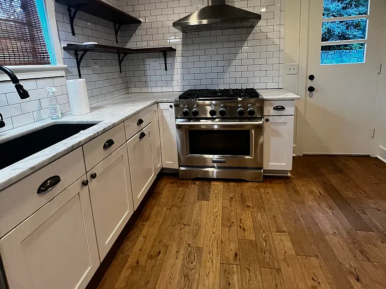 open shelving, kitchen aid gas range, large oven