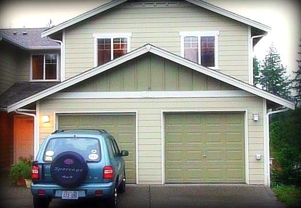 Front of the house with one car garage and private parking.