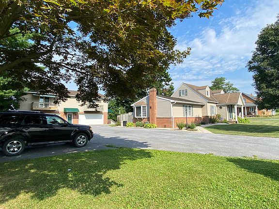 Property. Apartment is in the back building on the left