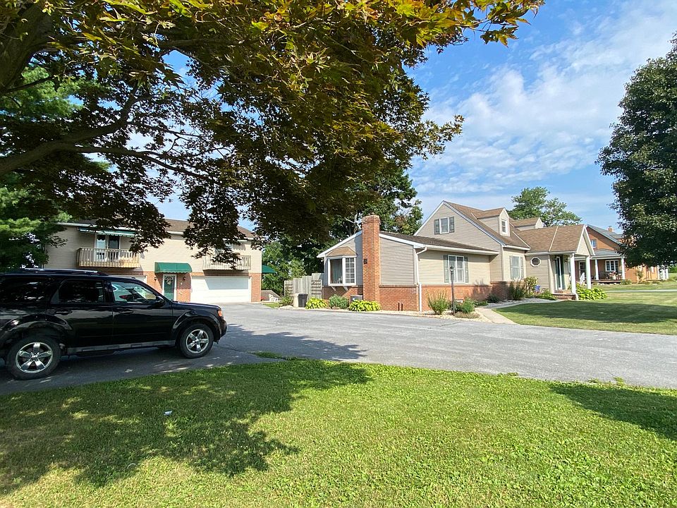 Property. Apartment is in the back building on the left