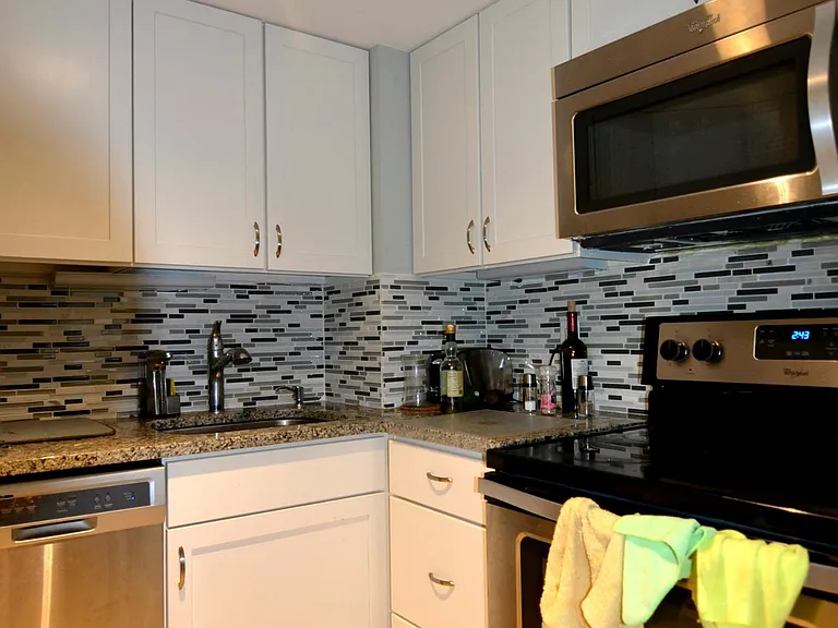 Modern kitchen with granite countertops and ample storage