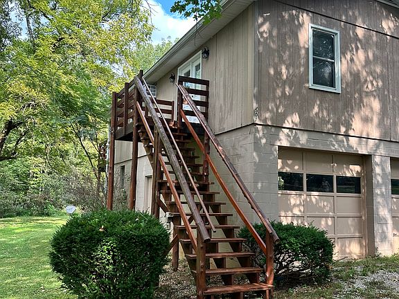 Apartment over garage. Deck leads up to double doors to the living room.