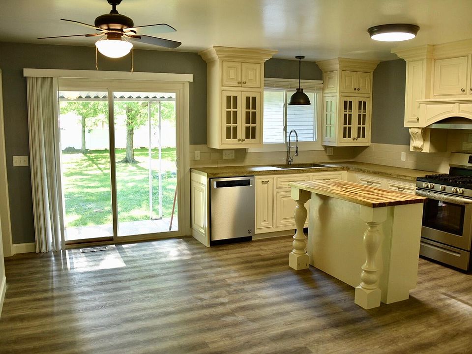 Brand new kitchen with custom cabinets and butcher block island