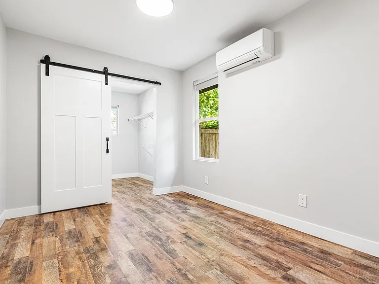 Primary bedroom, barn door to closet