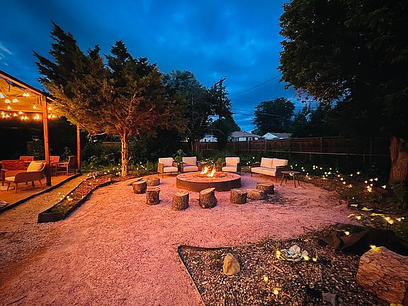 Magical backyard with pergola, fire pit and surround sound for entertaining at home.