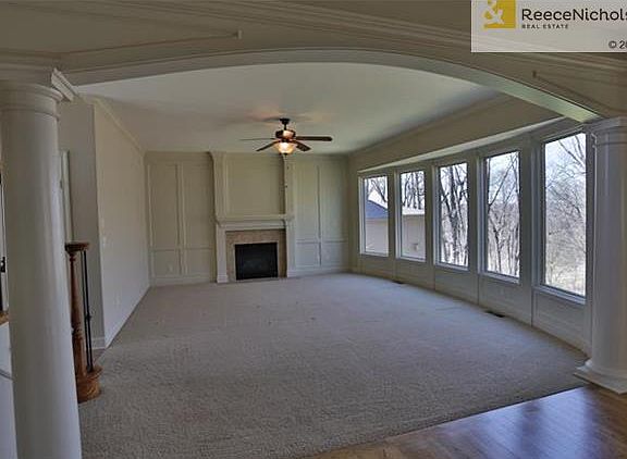 Living Room windows open up to the scenic nature.