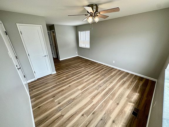 Living room with fresh paint and new floors.