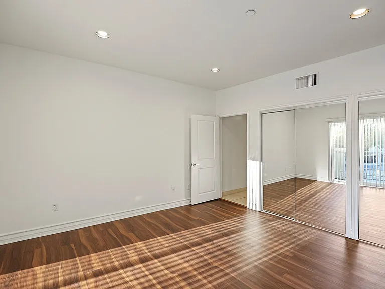 Large-Size Bedroom with Double Closets and Vinyl Flooring