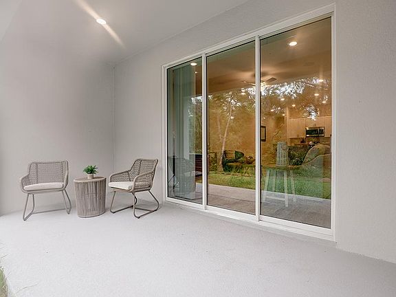 Your interior opens to outdoor living space on a large covered lanai - Aspen townhome by Highland Ho