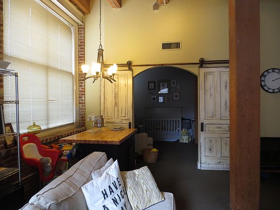 Barn doors open into one of the bedrooms.