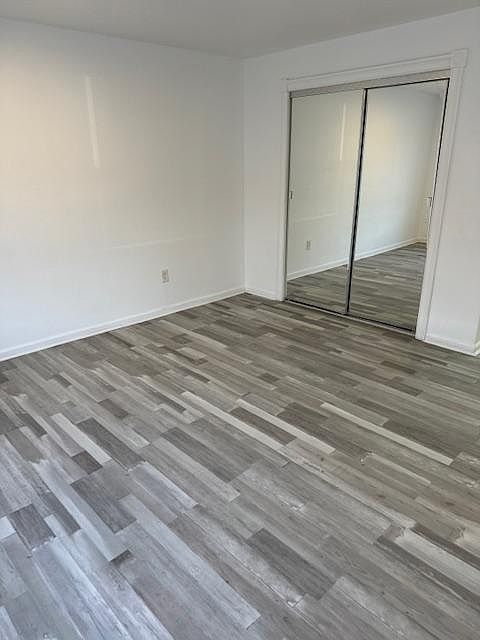 Bedroom/Living Space with ample closet space, mirrored door.