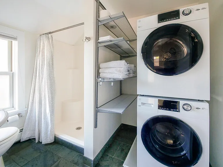 2nd floor. Laundry and shower. The bathroom is small but very functional. Towels and shower curtain included.