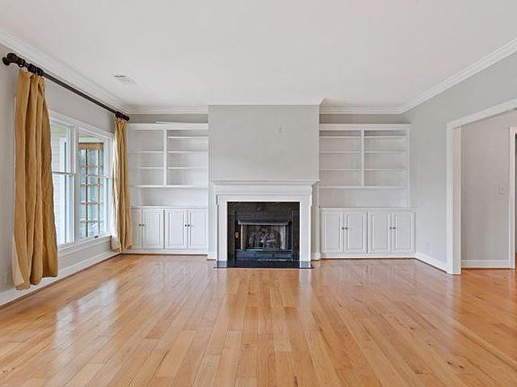 Den area with fireplace and built-ins