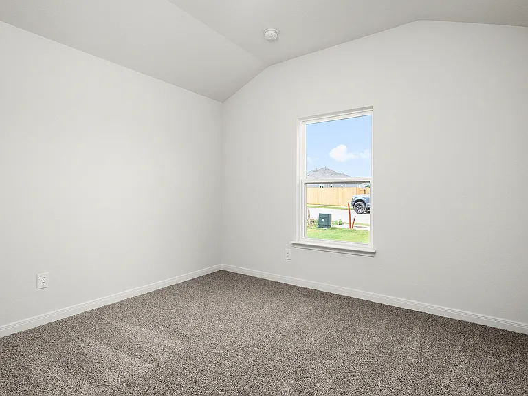 The secondary bedroom is a great space for a child's bedroom or a guest room.