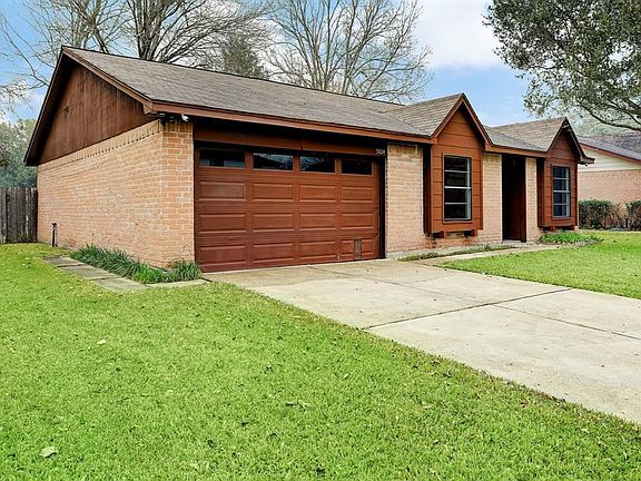 Two car garage with a built-in work bench.