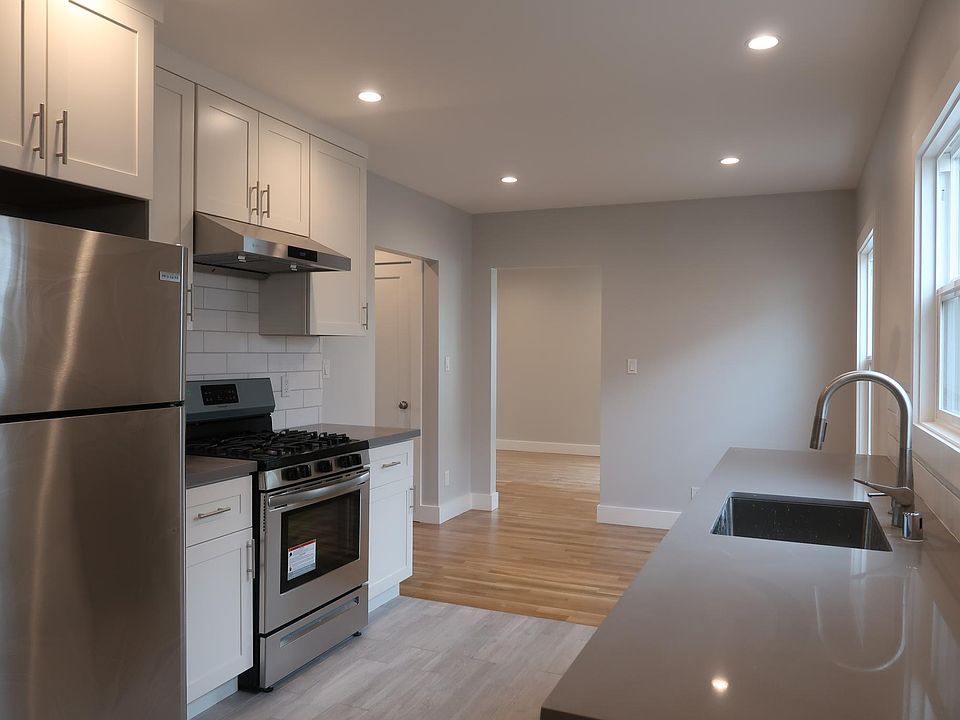 Kitchen looking toward breakfast area through to living room. Bed and bath hall to the left.
