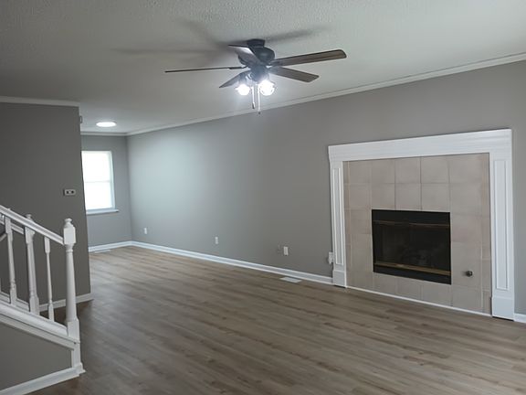 Great Room with New Luxury Laminate Flooring, New Paint on Ceilings, Walls, and Trim.