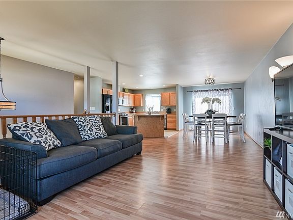 Open concept living on the upper floor with access to the deck