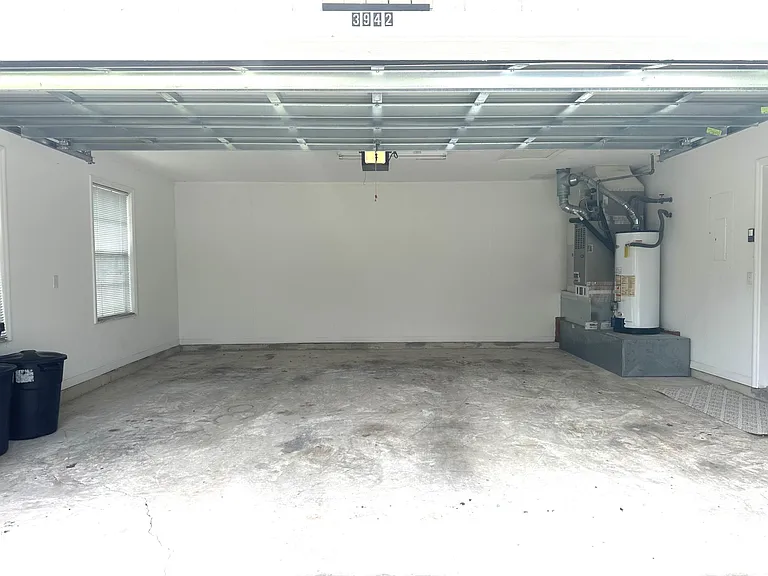 Large 2-car garage with electric door opener.