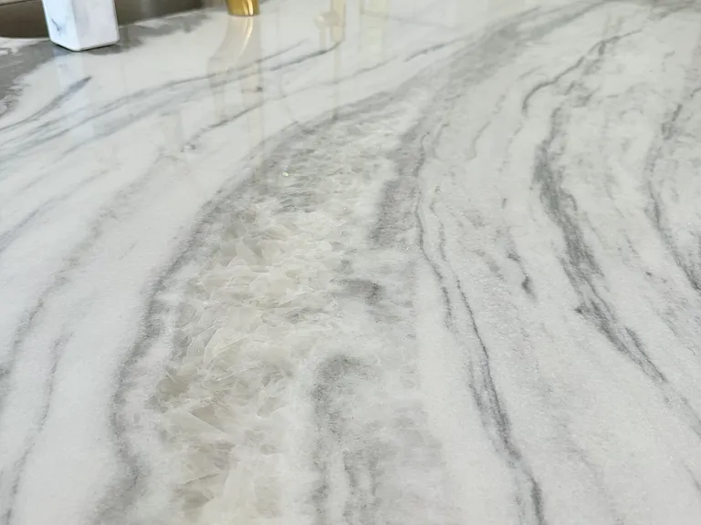 Elegant Natural Stone Counters throughout.
