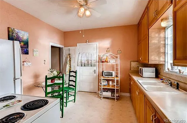 Kitchen has been painted since this photo was taken but it is helpful to see it with furnishings for context