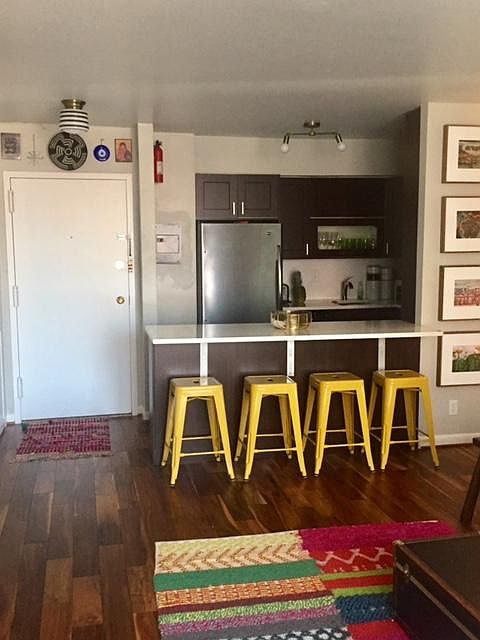Front entrance, kitchen and counter seating; daytime