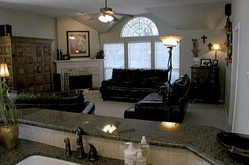 Light and bright family room opens to kitchen.