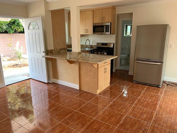 Open the door and the living Room opens to the kitchen