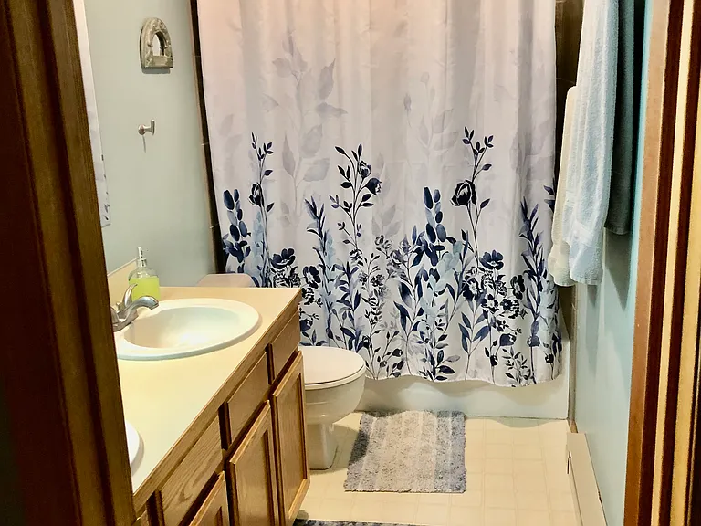 Full Bath with lots of cabinets and shelves and two sinks..